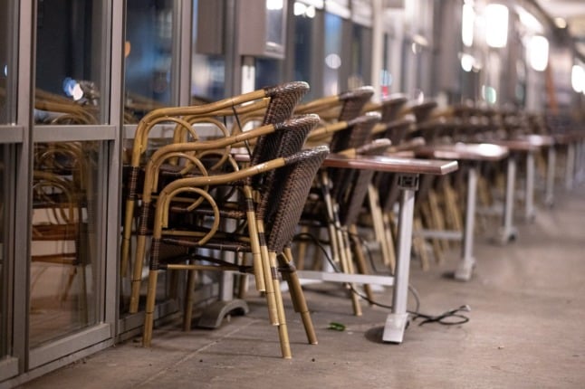 Chairs stacked at a restaurant in Hamburg.