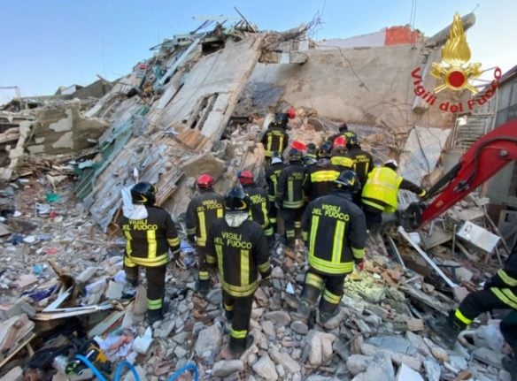 Firefighters at the site of the blast in Ravanusa, Sicily, on Monday.