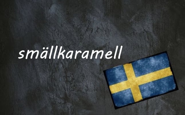the word smällkaramell on a black background beside a swedish flag