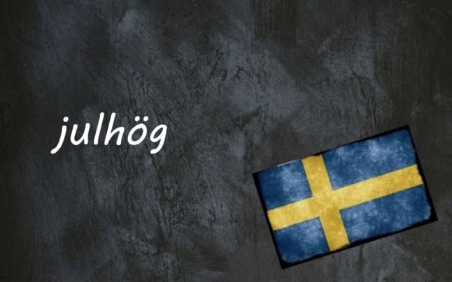 the word julhög on a black background beside a swedish flag