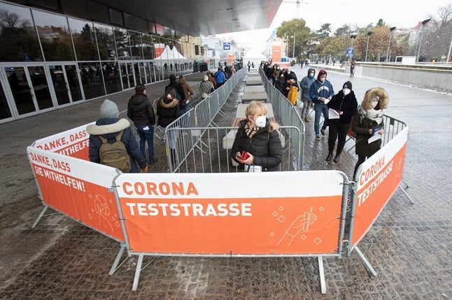 People line up outside the Stadthalle city hall in Vienna, Austria to get tested for Covid. (Photo by ALEX HALADA / AFP)