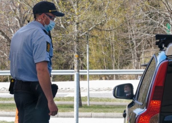 Pictured is a Norwegian police officer at the border with Sweden. 