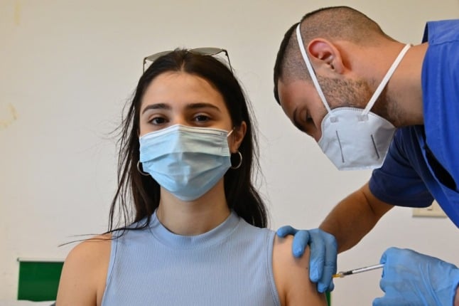 Woman receiving third Covid vaccine in Spain