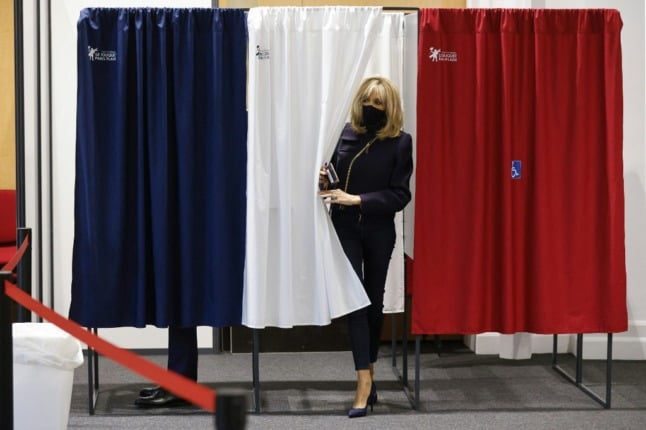 Brigitte Macron leaves a polling booth after voting in a French regional election. 