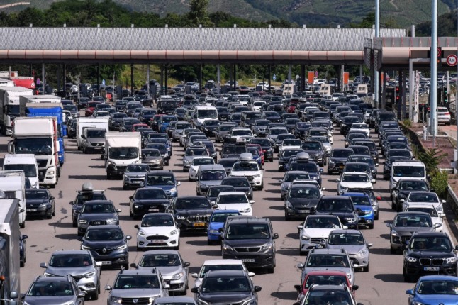 Motorists drive through the A7 toll booth in France. 