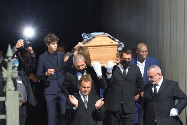 People attend a funeral in Marseille.