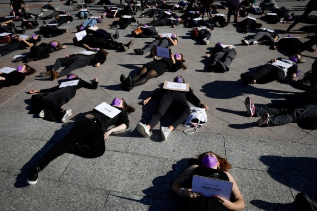 Activists stage a mass die-in to protest the French government's failed effort to tackle the problem of gender-based violence. 