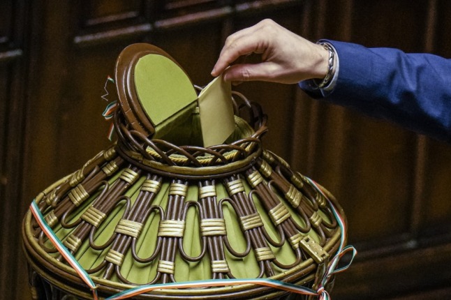 A voter casts their ballot in Italy's parliament during the first round of voting in the presidential election.