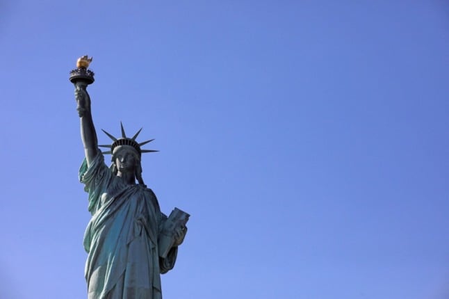 The Statue of Liberty stands tall above New York.