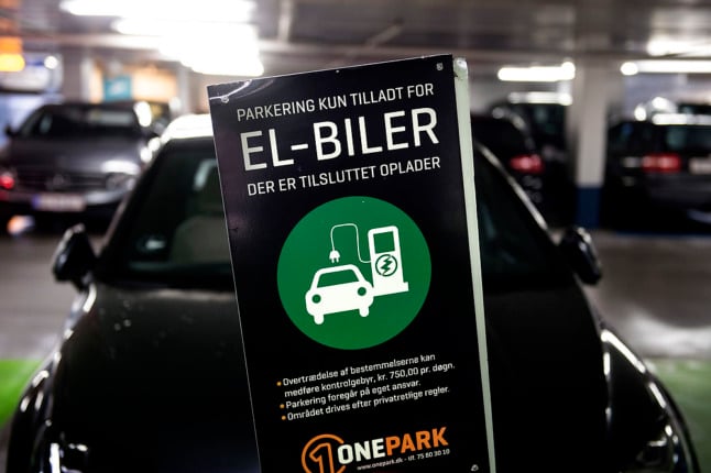 A parking spot for charging electric and hybrid cars in Copenhagen. A tax incentive for the latter type of vehicle has been criticised by left wing parties.