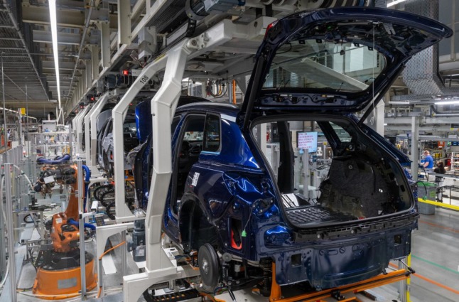 Robots assemble an Audi Q4 e-tron at the Volkswagen plant in Zwickau, Saxony. 