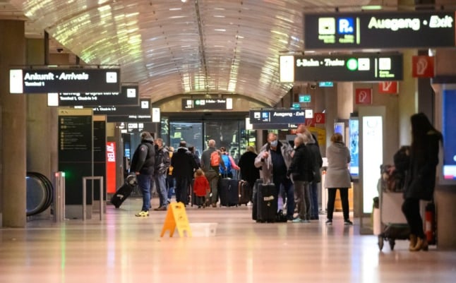 People walk in Hamburg Airport earlier in January. 