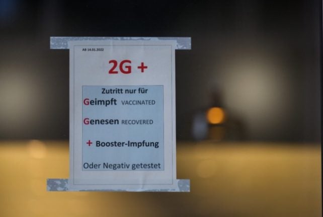 A sign on a restaurant in Dresden says entry is only for people who are vaccinated, recovered with a booster or a negative test. 
