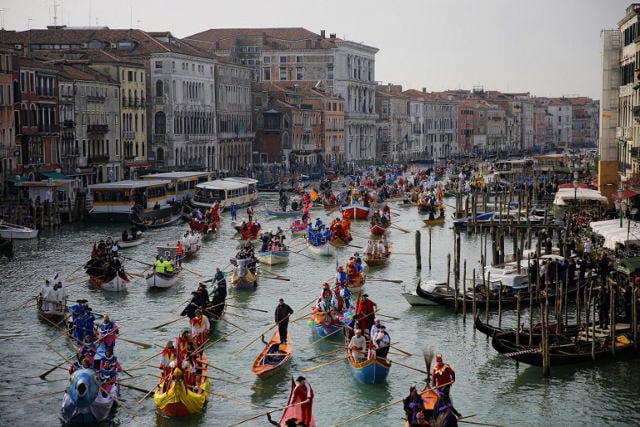 Boats move down the grand canal in Venice as part of the carnevale festivities.