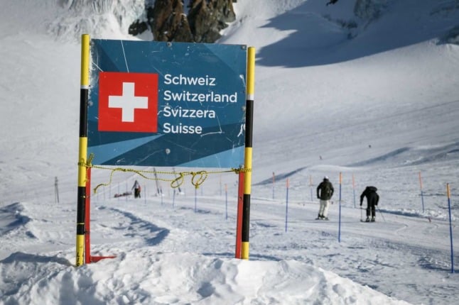 A sign on the Swiss border near Zermatt in the Swiss Alps. Photo: FABRICE COFFRINI / AFP