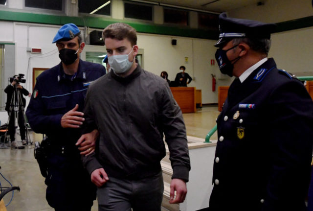Gabriel Natale-Hjorth is escorted by police after the court decision in his trial on charges of murdering Italian police officer Mario Cerciello Rega, in Rome on May 5, 2021.