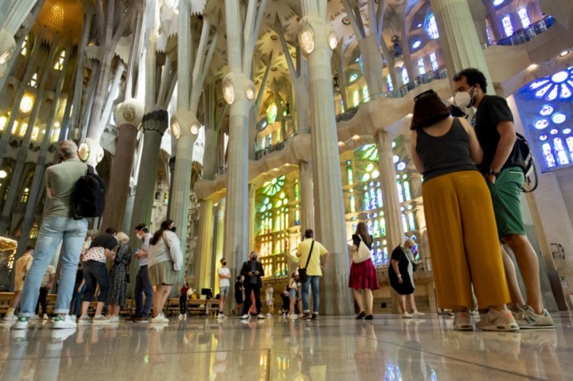 People visit the Sagrada Familia basilica in Barcelona on May 29, 2021 as it reopens for tourist visits. (Photo by Josep LAGO / AFP)
