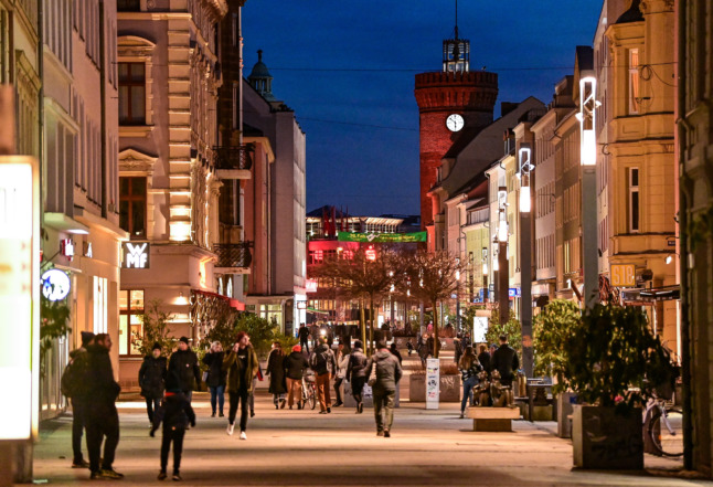 People walking on a busy street in Cottbus. Non-essential shops in many parts of Germany bar unvaccinated people currently.