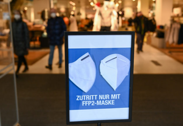 A sign for FFP2 masks at the front of a shop in Frankfurt.