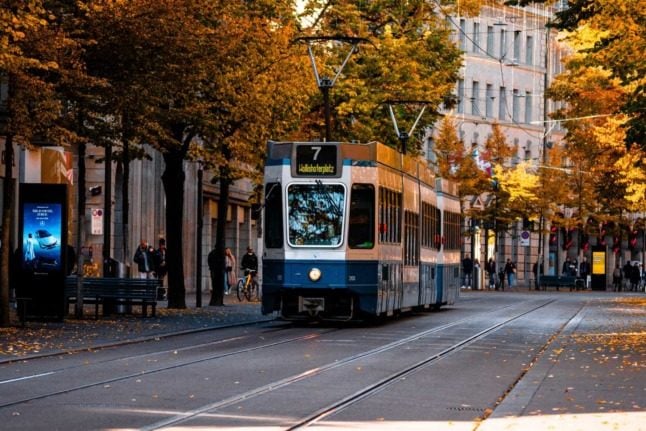 A tram weaves its way through the Swiss city of Zurich. Public transport can technically not be free in Switzerland due to constitutional rules. Photo by Abdul basit on Unsplash