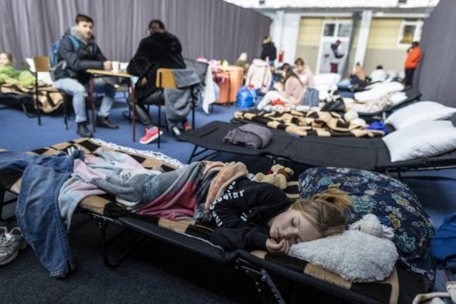 Swiss volunteers are getting ready to deliver blankets and other essential supplies to refugee centres, like this one. Photo by Wojtek RADWANSKI / AFP