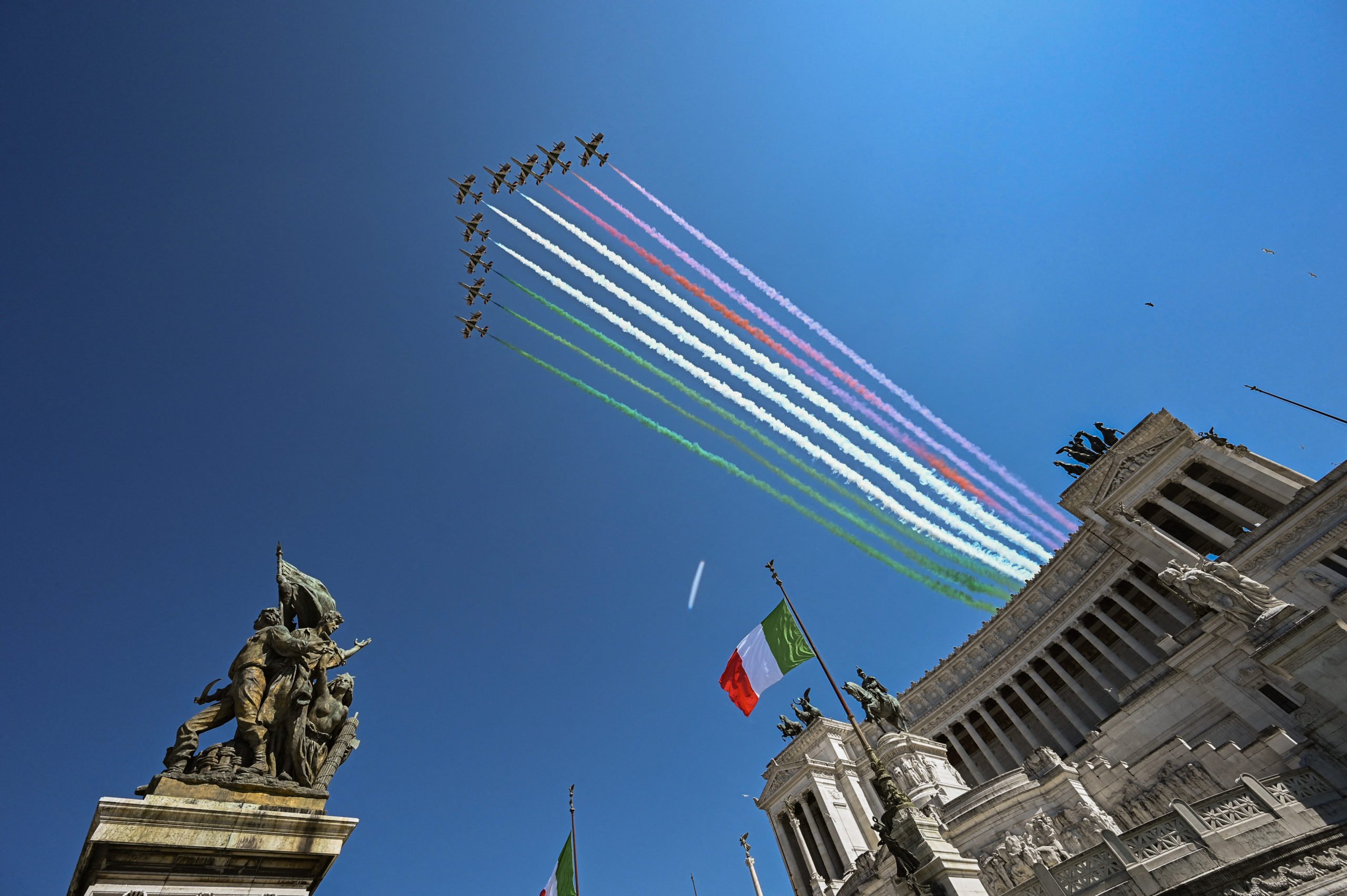 The Italian Air Force aerobatic unit performs on April 25, 2020, Italy's 75th Liberation Day, over the Altare della Patria monument in Rome. 