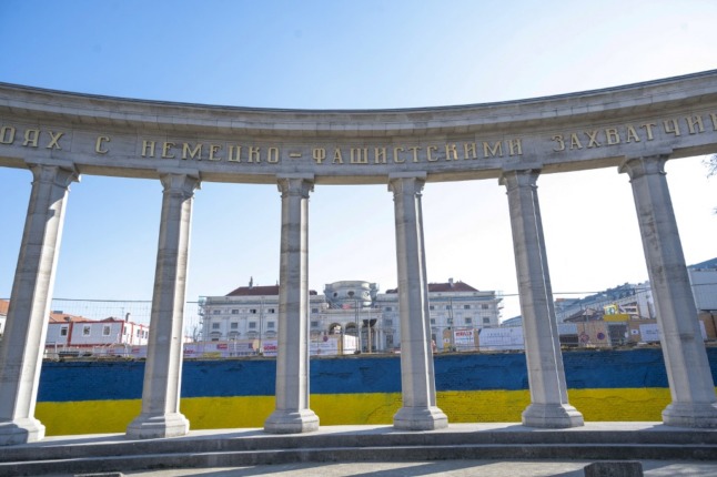 A wall behind the Soviet War Memorial (that commemorates the Soviet soldiers who were killed in the battle for Vienna during WWII) is painted in Ukrainian national colours