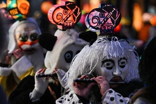Tens of thousands returned to the Basel Carnival after two years of cancellations due to the Covid pandemic. Photo: SEBASTIEN BOZON / AFP