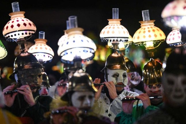 Tens of thousands returned to the Basel Carnival after two years of cancellations due to the Covid pandemic. Photo: SEBASTIEN BOZON / AFP