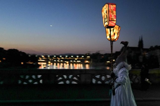 Tens of thousands returned to the Basel Carnival after two years of cancellations due to the Covid pandemic. Photo: SEBASTIEN BOZON / AFP