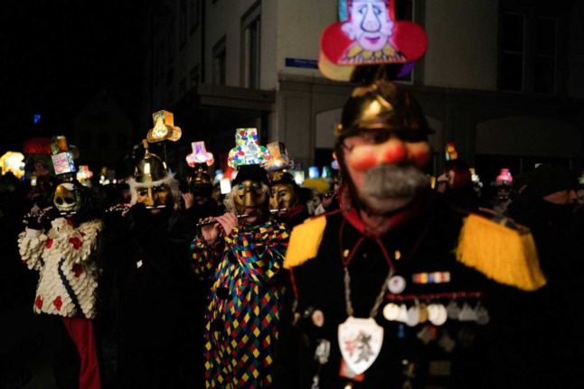 Tens of thousands returned to the Basel Carnival after two years of cancellations due to the Covid pandemic. Photo: SEBASTIEN BOZON / AFP