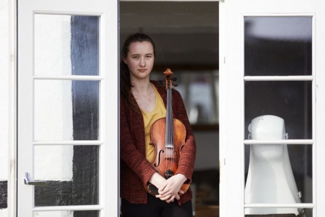 A 23-year-old musician from Ukraine, poses with her violin in Stevns, Denmark on March 10, 2022.