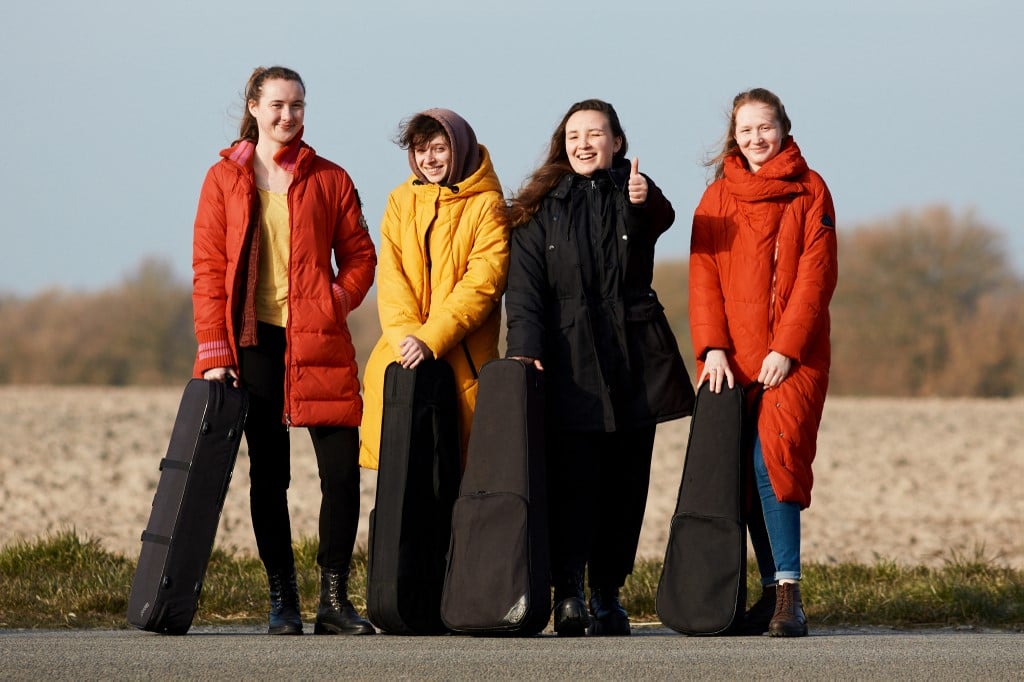 Four musicians who have fled Ukraine pose in Stevns, Denmark on March 10, 2022.