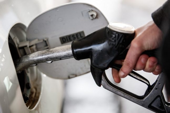 A motorist fills a car at a petrol station in Caen, France