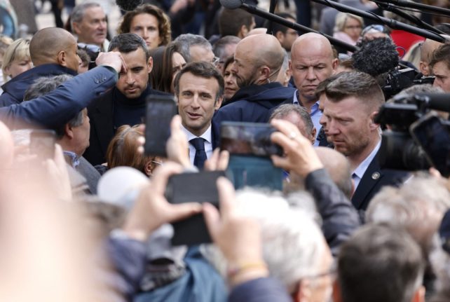 Macron rallies campaign team as Le Pen gains in polls