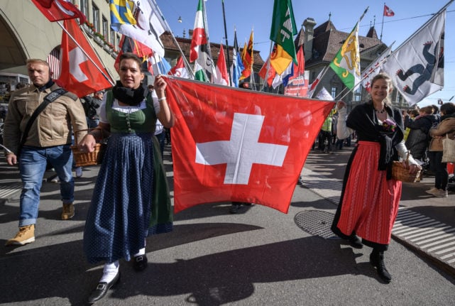 Covid sceptic protesters during a rally in the Swiss city of Bern. Photo: Fabrice COFFRINI / AFP
