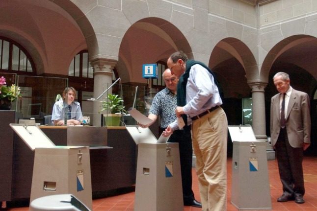 A man casts a ballot in the Swiss city of Zurich. Photo: ANDY MUELLER / EQ IMAGES / AFP