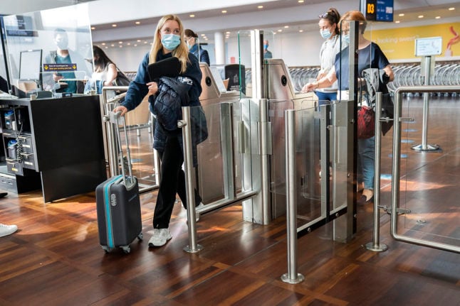 airport passengers with face masks on in denmark