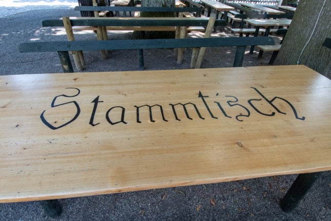 The word Stammtisch written on a table in an outdoor beer garden in Bavaria. Photo: DPA/Picture Alliance