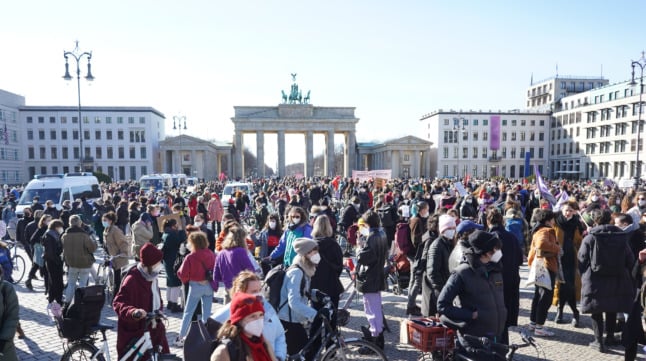 Women take part in a demo calling for equal rights on International Women's Day 2021 at Berlin's Brandenburg Gate.