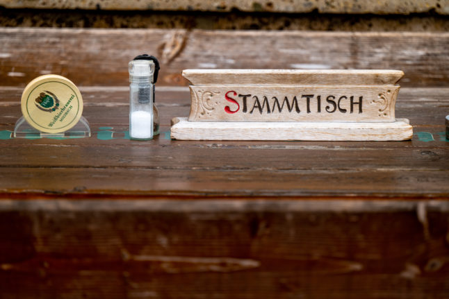 A Stammtisch sign on a table. Photo: DPA/Picture Alliance