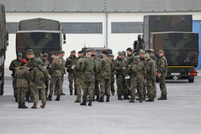 Bundeswehr soldiers gather at a training area before travelling to Lithuania for a NATO mission in February.