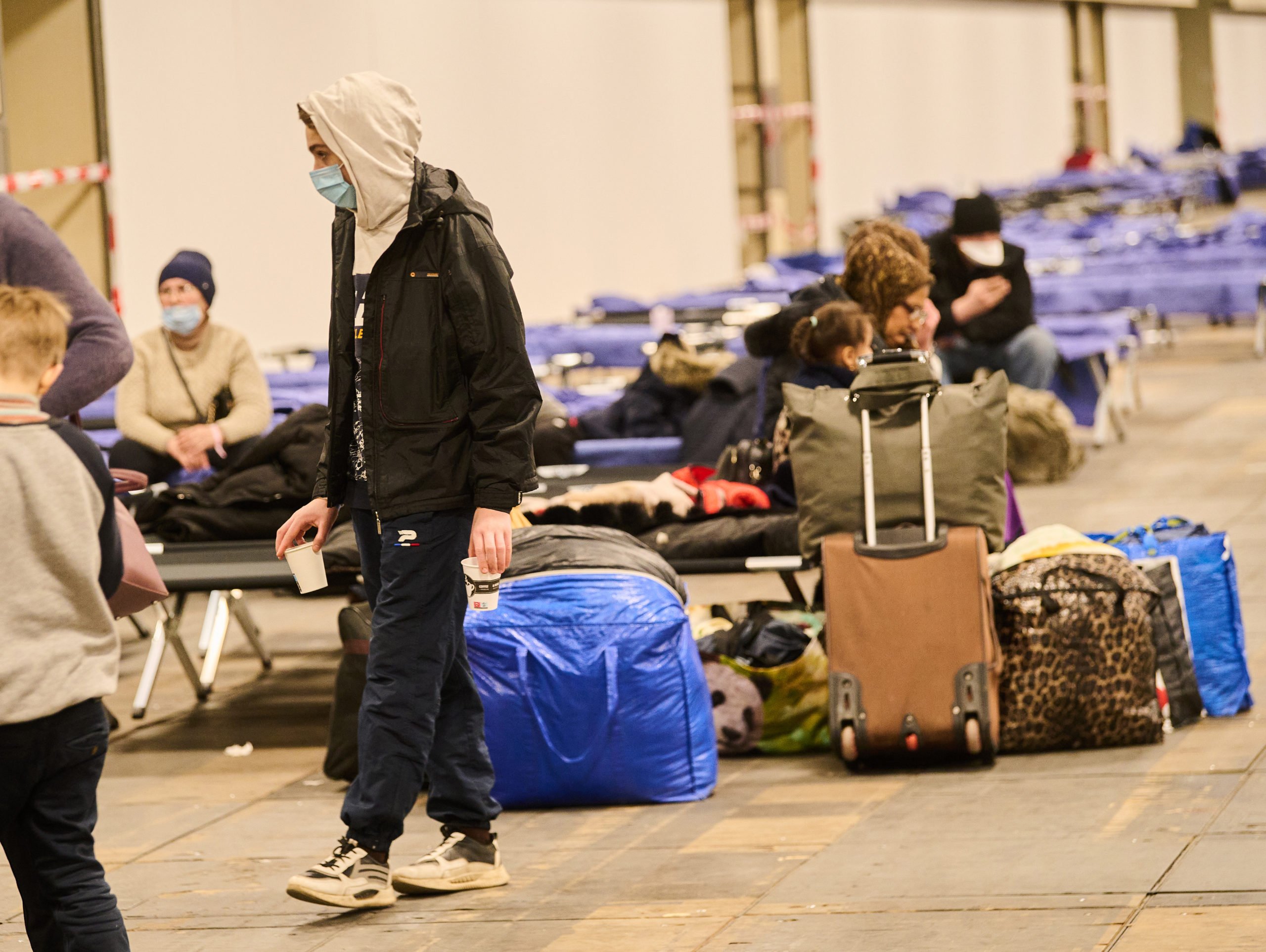 People who have fled war in Ukraine at a refugees arrival centre in Berlin.
