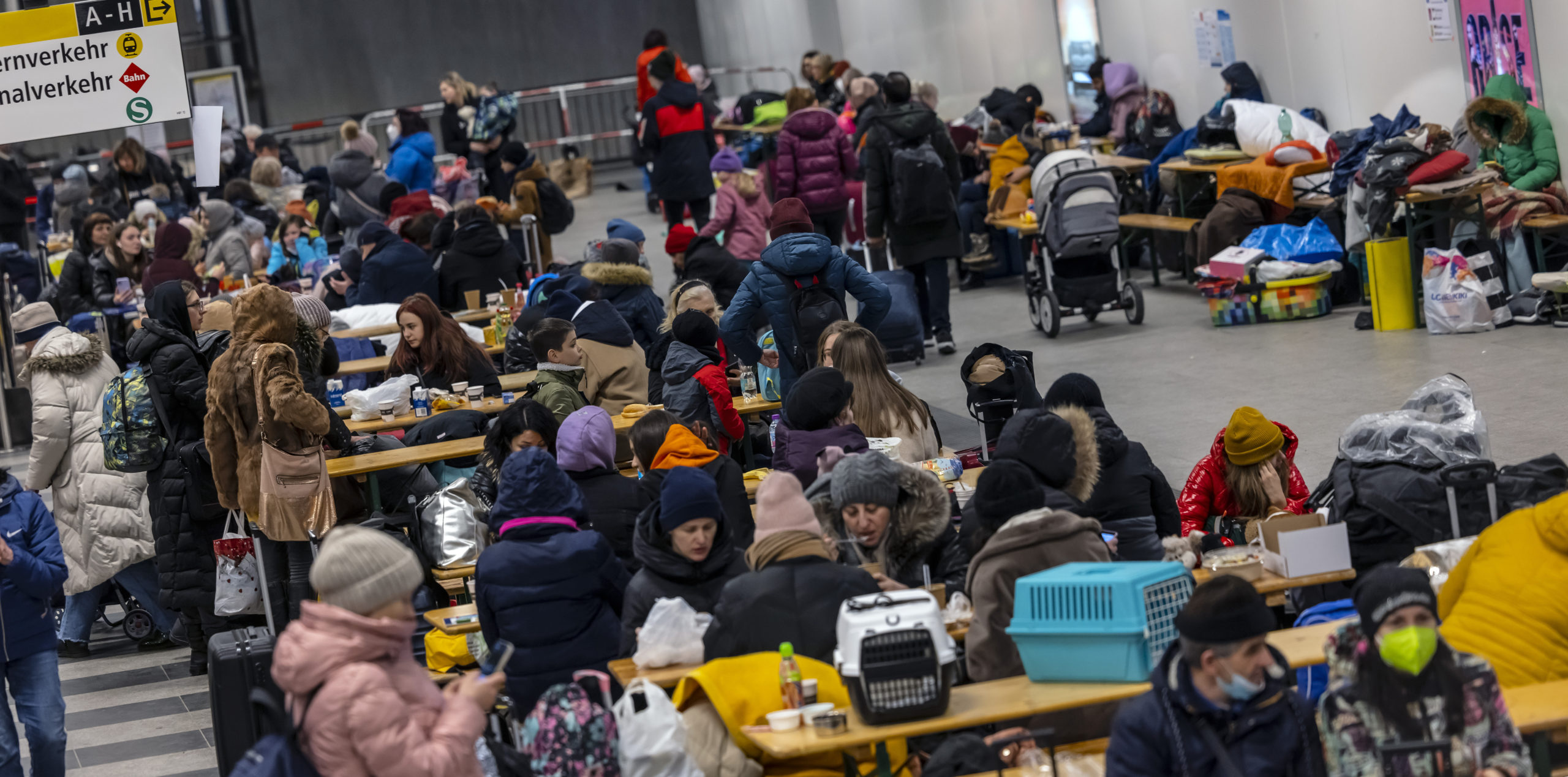 Refugees wait in Berlin main station.