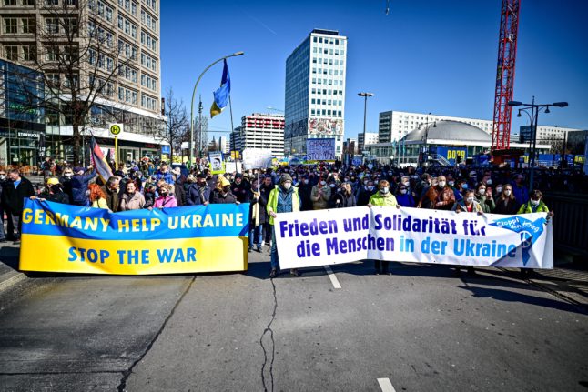 Demonstrators against Russia's invasion of Ukraine hold signs calling for peace in Berlin on March 13th.