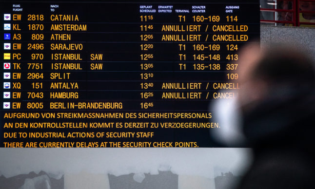 A board in Stuttgart airport shows cancelled flights.