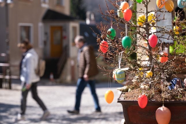 Easter eggs hang from a tree in Schmilka, Saxony.