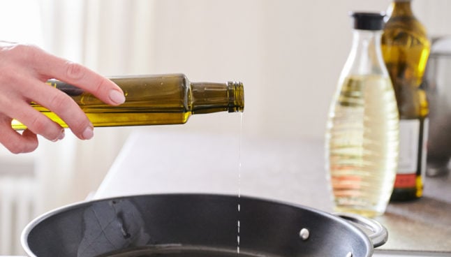 A person using cooking oil.