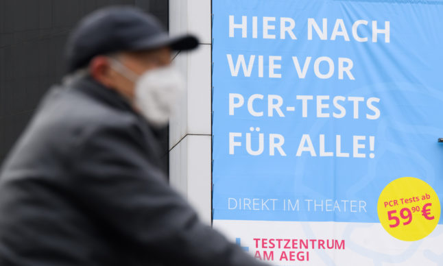 A sign advertises PCR tests in Hannover