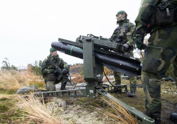 Troops from the Swedish Amphibious Corps on exercise with a Robot 17 surface-to-air missile.